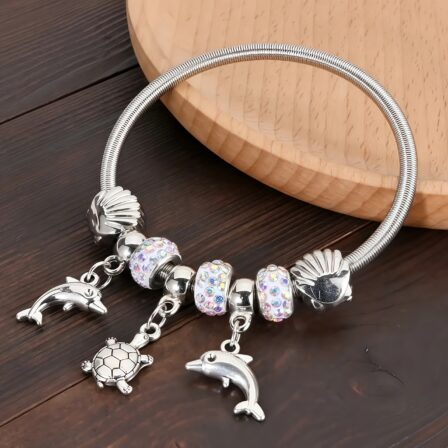 Pulsera de la amistad con temática marina, con dijes de delfín y tortuga